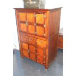 An Oriental design elm cabinet