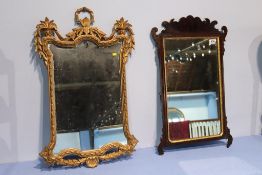 A gilt framed mirror and one other