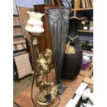 A gilt lamp and two large vases