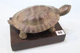 A quantity of carved wood figures and a turtle