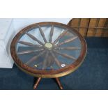 An oak ships wheel style coffee table