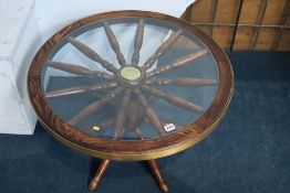 An oak ships wheel style coffee table
