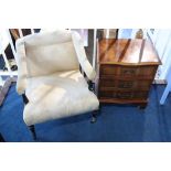 An Edwardian open armchair and a yew chest of drawers