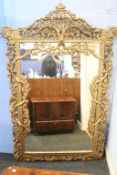 A large mirror in ornate carved gilt frame, 155 x 240cm