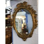 A gilt framed mirror