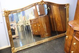 An ornate gilt framed over mantle mirror, 186cm