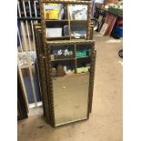 A quantity of gilt framed mirrors