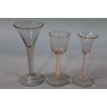 A Georgian opaque air twist glass, with bell shaped bowl and two clear glass wine glasses