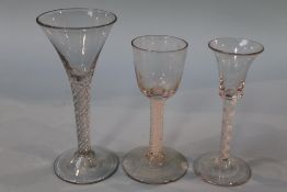 A Georgian opaque air twist glass, with bell shaped bowl and two clear glass wine glasses