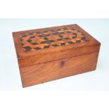 A walnut parquetry work box, a carved wood box and two others