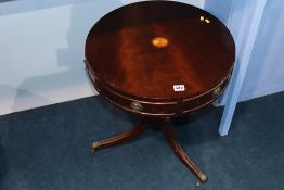 A reproduction mahogany Drum table