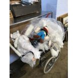 A pram and various dolls