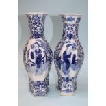 A pair of Chinese octagonal vases, in blue and white, decorated with female figures, signed in