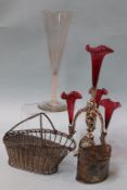 A silver plated epergne, a plated wine bottle holder, a very tall trumpet shaped air twist glass,