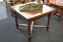 An oak barley twist extending dining table