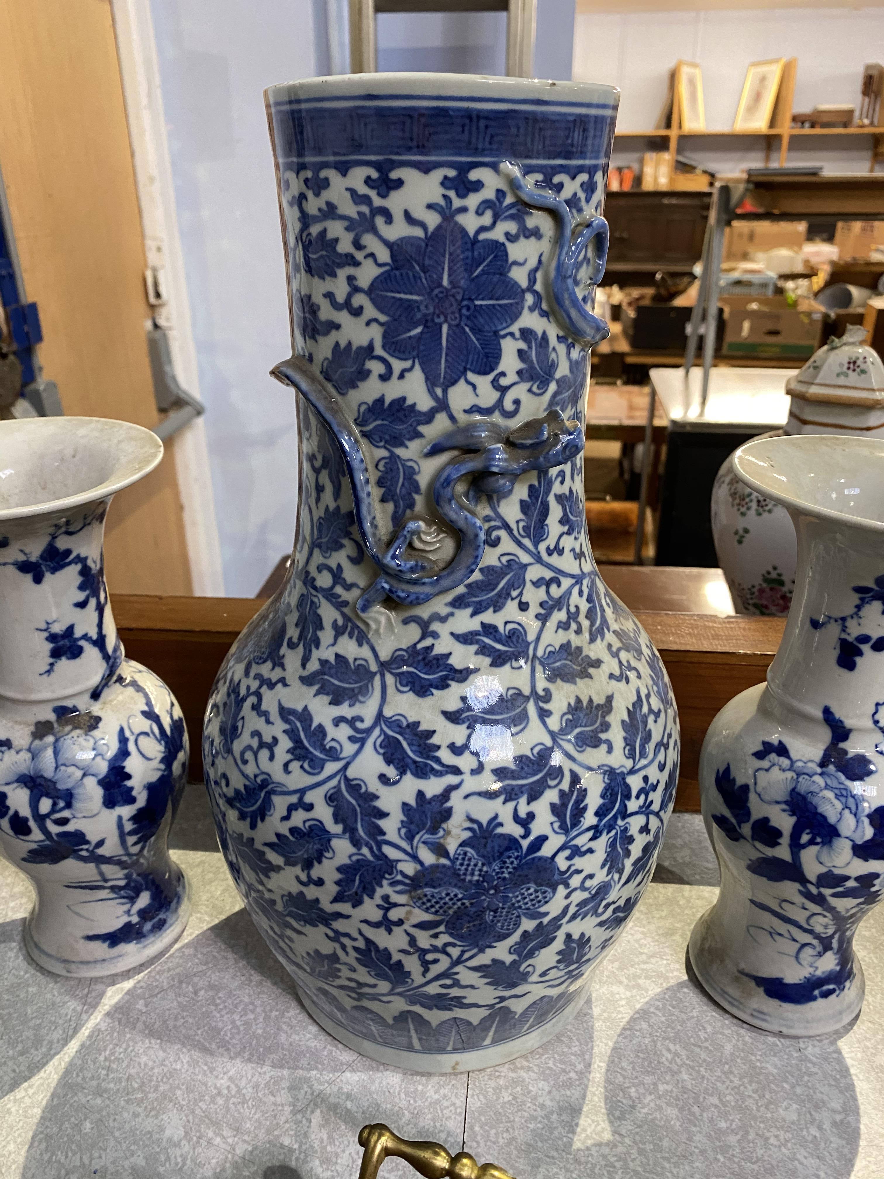 A Chinese blue and white baluster shaped vase, decorated with flowers and leaves, and an applied - Image 2 of 23