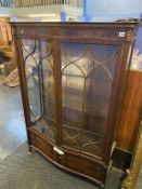 An Edwardian mahogany bow front china cabinet