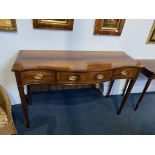 A reproduction mahogany serpentine fronted three drawer serving table, 37cm wide