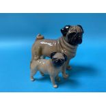 A Beswick CH Cutmil Cupie Pug figurine and a smaller Pug figurine (2)