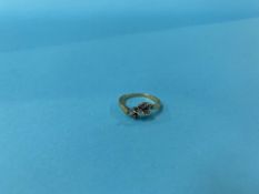 An 18ct gold and diamond ring, 3g