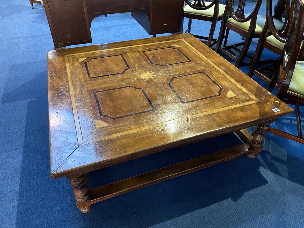 A large square coffee table with parquetry top, 191cm