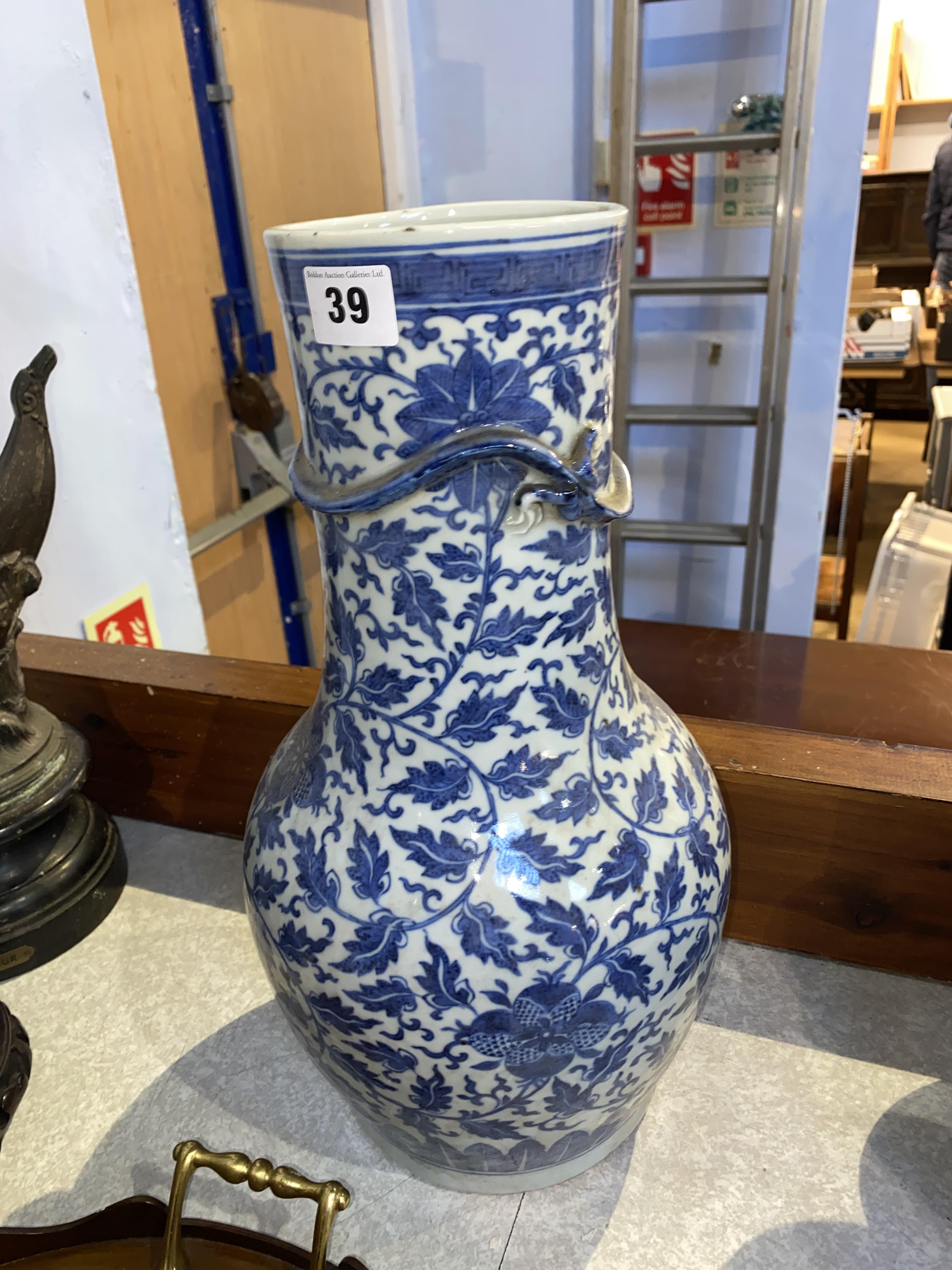 A Chinese blue and white baluster shaped vase, decorated with flowers and leaves, and an applied - Image 19 of 23