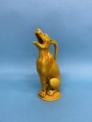 A Burmantofts yellow faience grotesque seated Ibex ewer, impressed mark 555, 32cm high