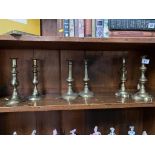 Three pairs of brass candlesticks