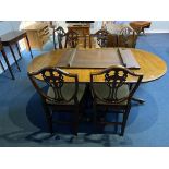 A reproduction mahogany dining table with six chairs
