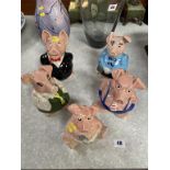 A set of five Nat West pigs