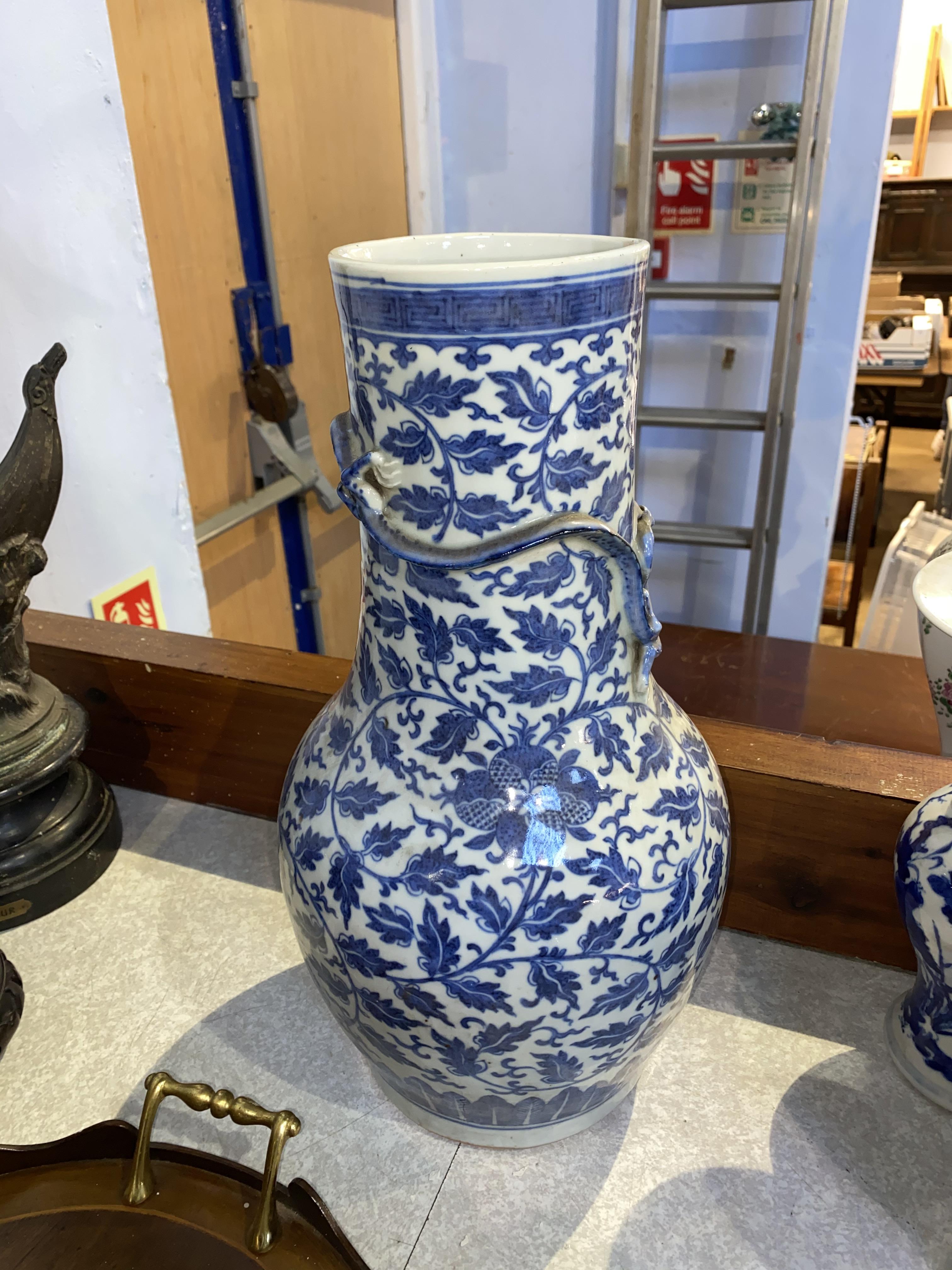 A Chinese blue and white baluster shaped vase, decorated with flowers and leaves, and an applied - Image 18 of 23