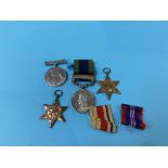 Three unnamed World War II medals and an Indian medal with North West Frontier, 1930-31, bar to