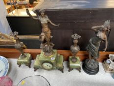 An Onyx and spelter three piece clock garniture and another spelter figure