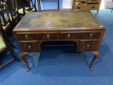 A walnut ladies writing desk, with inset leather top, 105cm wide