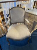 A mottled grey French style open armchair