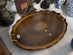 An Edwardian oval two handled tea tray