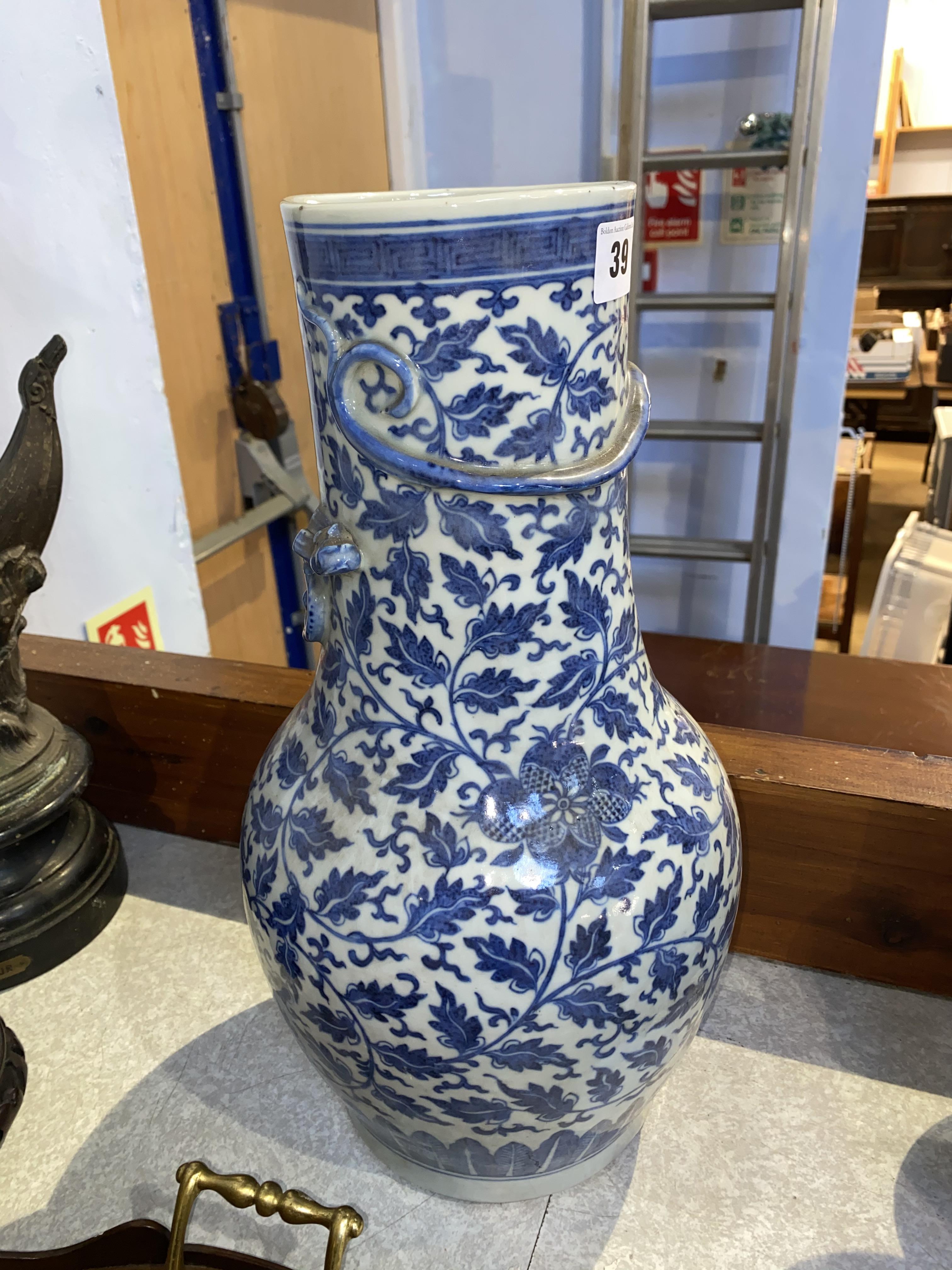 A Chinese blue and white baluster shaped vase, decorated with flowers and leaves, and an applied - Image 20 of 23