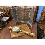 An oak two handled tea tray, barometer and a spark guard