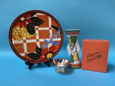 A Wedgwood Clarice Cliff 'Circles and Squares' vase and a 'Blossom' wall plate and a small bowl