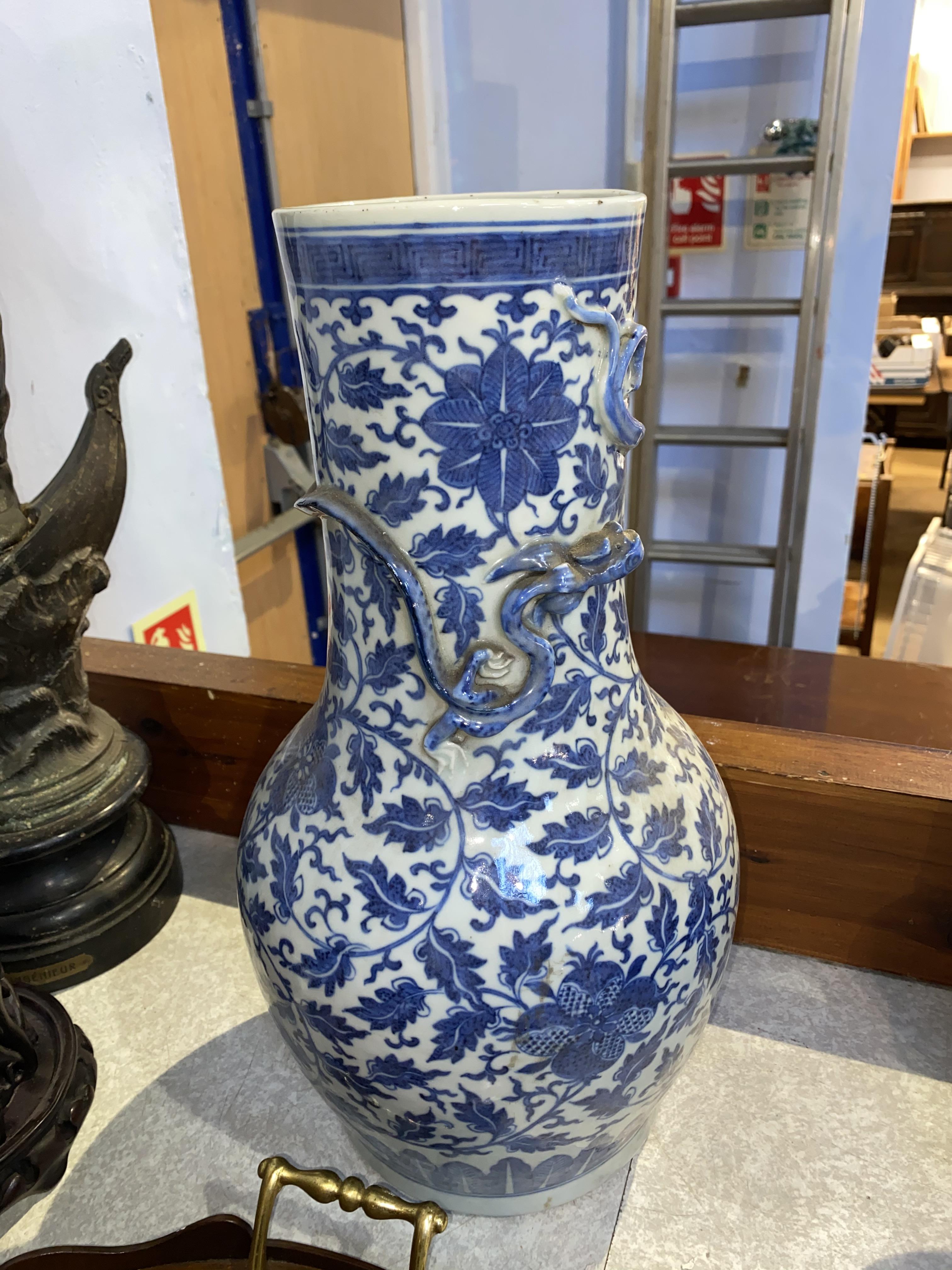 A Chinese blue and white baluster shaped vase, decorated with flowers and leaves, and an applied - Image 21 of 23