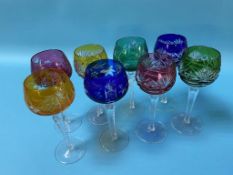 Eight coloured glass wine glasses