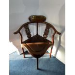 Two Oriental hardwood corner chairs