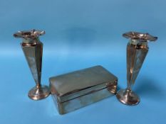 A pair of silver spill vases and a silver cigarette box
