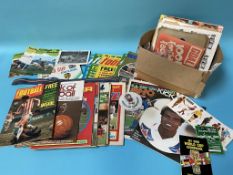 A collection of football programmes and magazines etc.