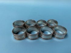 A set of eight silver napkin rings, 6.4oz