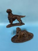 A cast bronze model of a retriever and another model