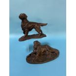 A cast bronze model of a retriever and another model