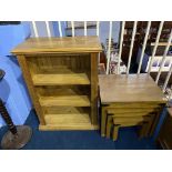 A pine bookcase and nest of tables