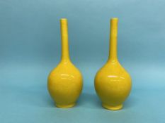 A pair of yellow ground baluster shaped vases, 30cm height
