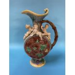 A Minton Majolica wine ewer, decorated with putti, grapes and vine leaves, impressed marks, 37cm